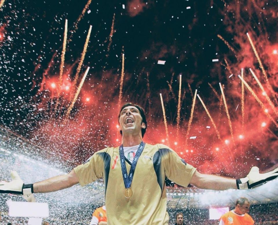 Gianluigi Buffon lifting the FIFA World Cup trophy with Italy at the 2006 World Cup in Germany — vintage Azzurri goalkeeper jersey collector's item