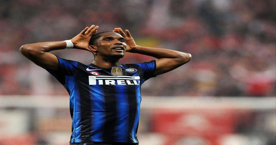 Samuel Eto'o celebrating with his hands cupped behind his ears, wearing Inter Milan's blue and black striped jersey