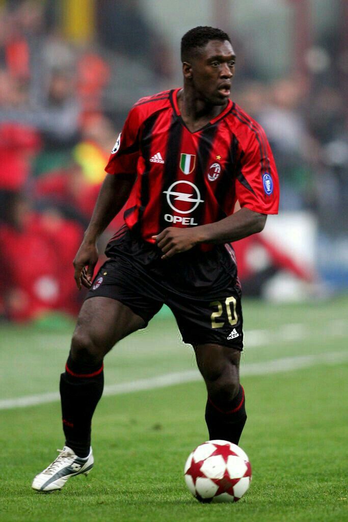 Clarence Seedorf in the iconic AC Milan red and black jersey — vintage Serie A football shirt